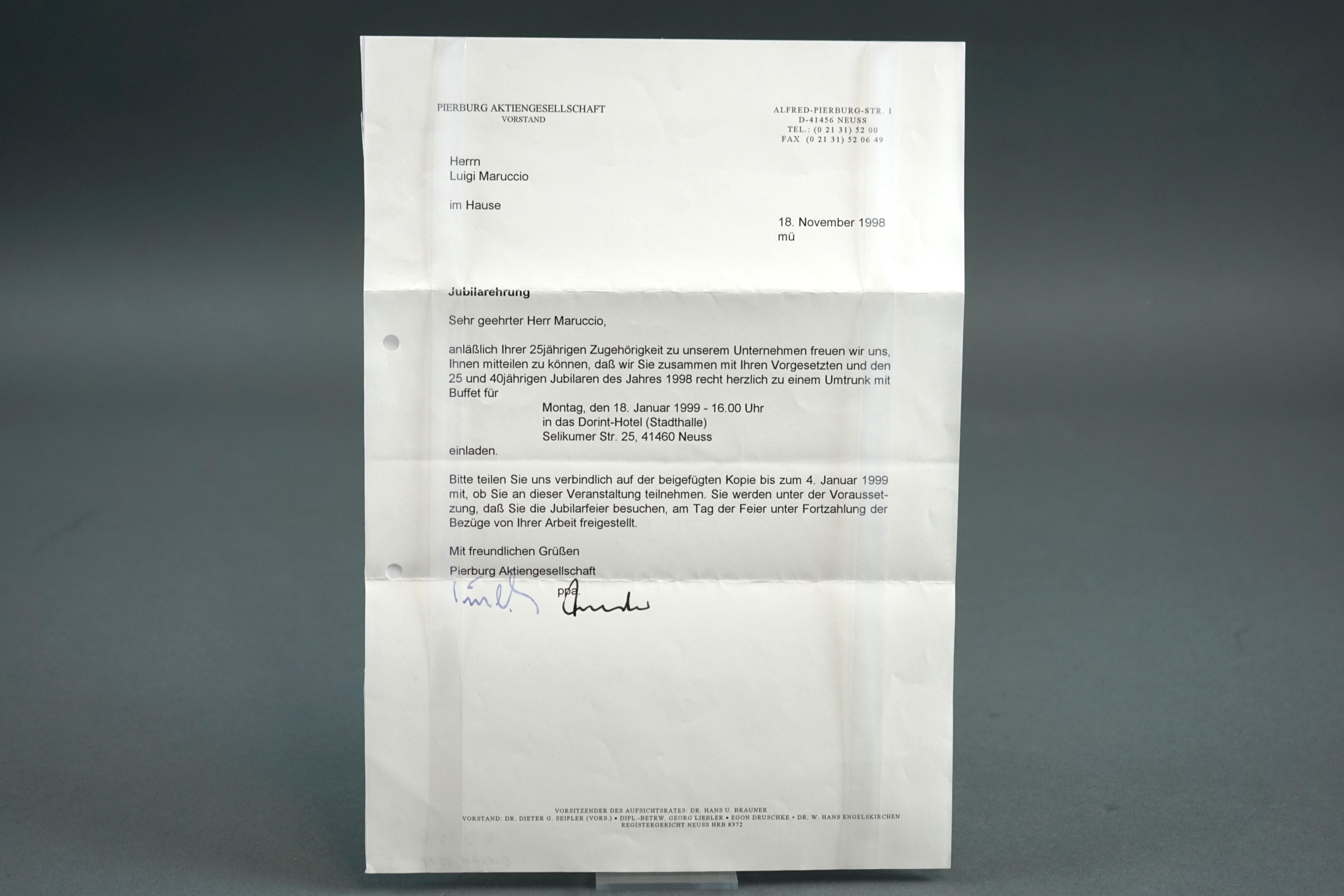 You see a letter in DIN A4 format, typed, with a handwritten signature.